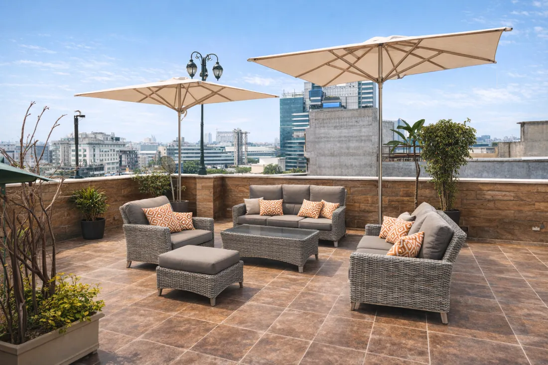 Rooftop with cream parasols and lounge seating